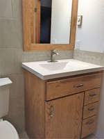 Thumb vanity  contemporary style  ash  light color  slab door  single sink  full overlay