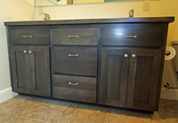 Thumb vanity  shaker style  hickory  grey color  recessed panel  wood countertop edge  bank of 3 drawers  standard overlay