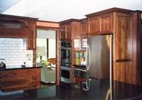 Thumb kitchen  traditional style  rustic maple  dark color  recessed panel doors and ends  angled wood hood   6 standard crown  standard overlay