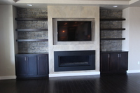 Thumb great room  contemporary style  western maple  recessed panel  dark  black  color  entertainment center  floating shelves  tv above the fireplace   wood tops  built ins  standard overlay