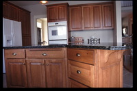 Thumb kitchen  craftsman style  quartersawn oak  medium color  raised panel  bread board  standard bar supports  standard overlay