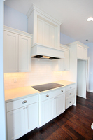 Thumb kitchen  shaker style  painted  wainscot and recessed panel  wood hood  staggered heights  5 piece fronts  full overlay