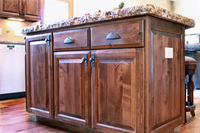 Thumb kitchen  traditional style  knotty alder  dark color  raised panel  raised panel end with outlet  full overlay