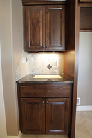 Thumb kitchen  traditional style  knotty alder  raised panel  dark color  drop zone  charging area  standard overlay